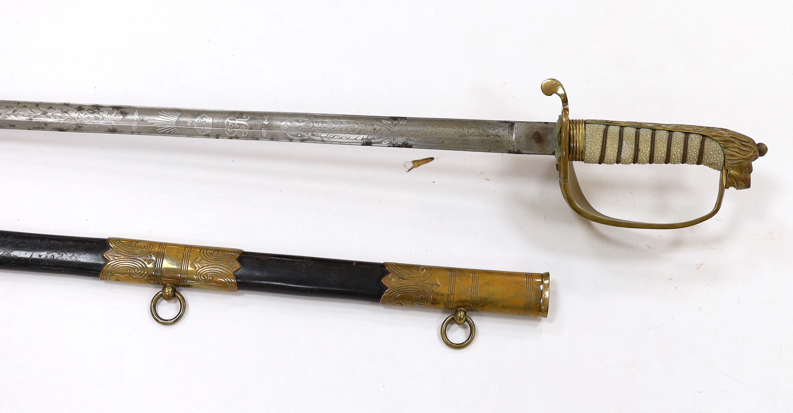 A George V naval officer’s sword, maker Grieves, in a leather scabbard, guard engraved G.P. Bewley, blade 79.5cm, together with outer leather cover